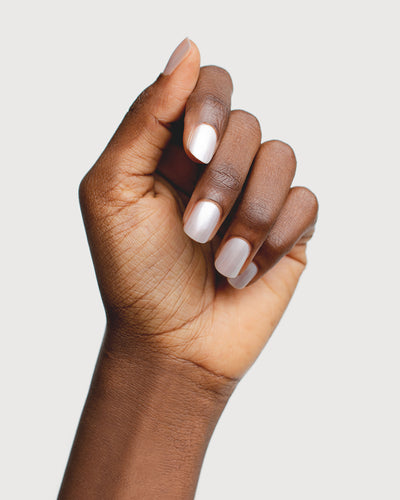 snow white pearl nail polish hand swatch on dark skin tone