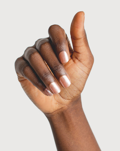 Radiant Rose Peach Crystal nail polish hand swatch on dark skin tone