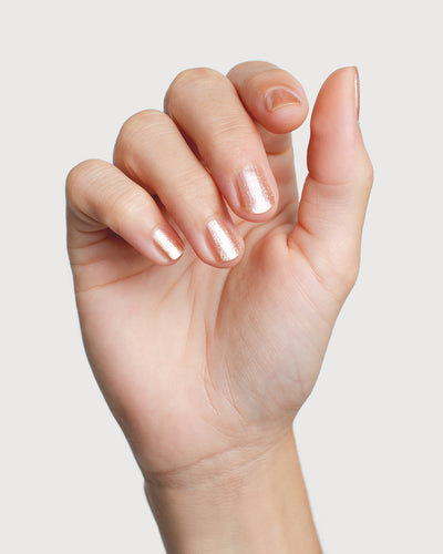 Radiant Rose Peach Crystal nail polish hand swatch on fair skin tone