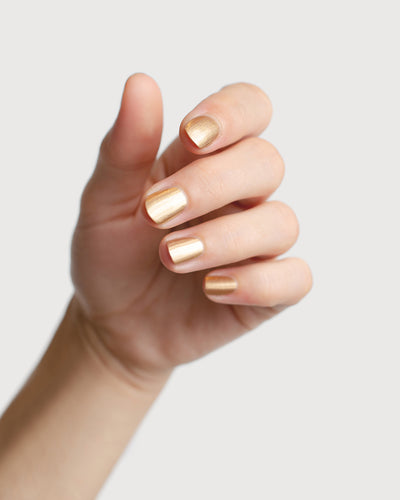  Solar Flare Gold Glaze nail polish hand swatch on fair skin tone