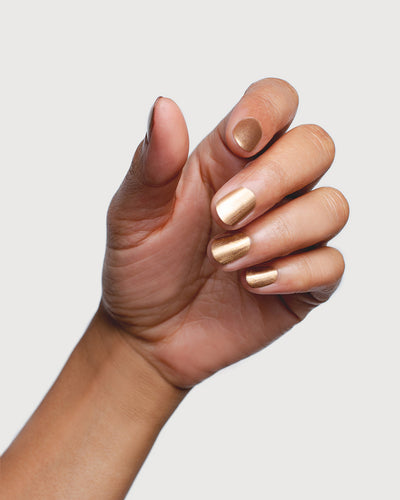 Solar Flare Gold Glaze nail polish hand swatch on medium skin tone