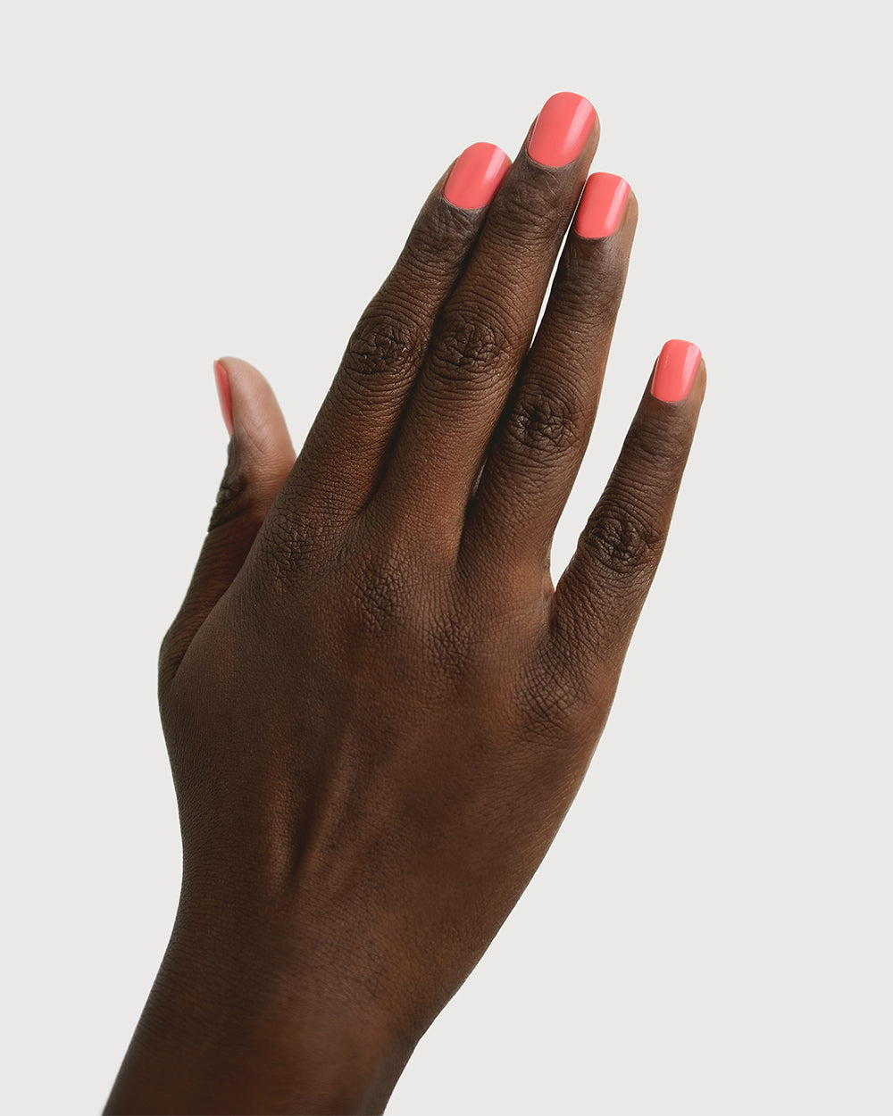 Grapefruit Pink nail polish swatch on dark Skin tone by Sienna Byron Bay