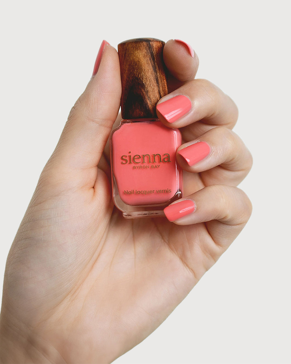 grapefruit pink nail polish swatch on fair skin tone by sienna
