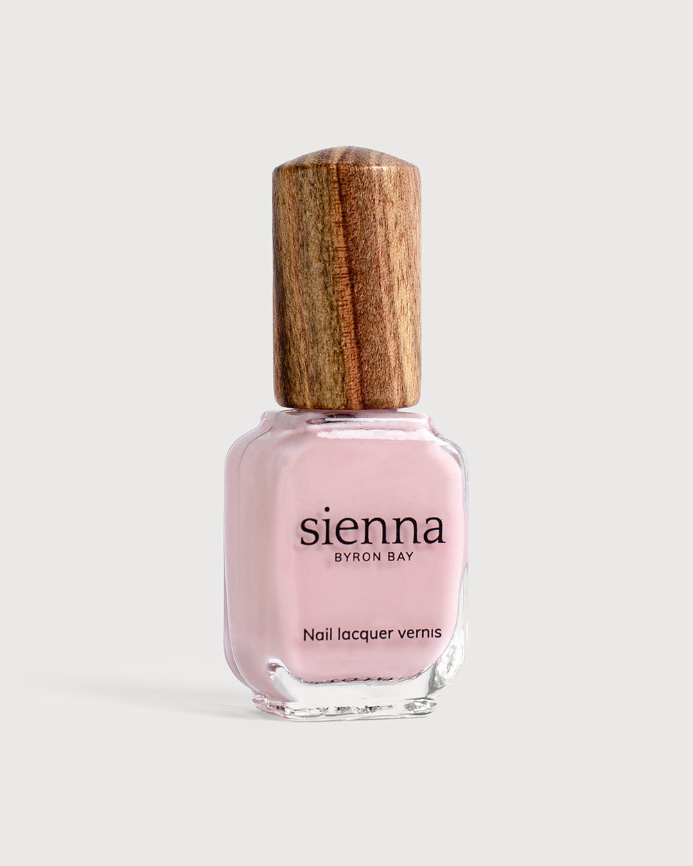 Amour soft pink crème nail colour bottle with Sienna signature timber cap