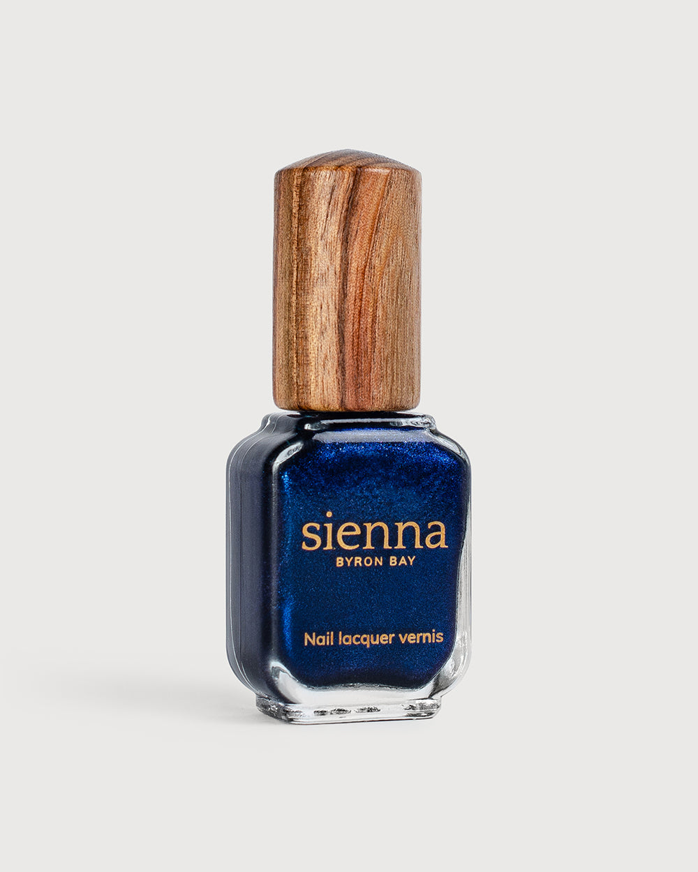 A bottle of Bonsoir metallic shimmer glaze with timber cap  