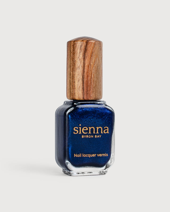 A bottle of Bonsoir metallic shimmer glaze with timber cap  