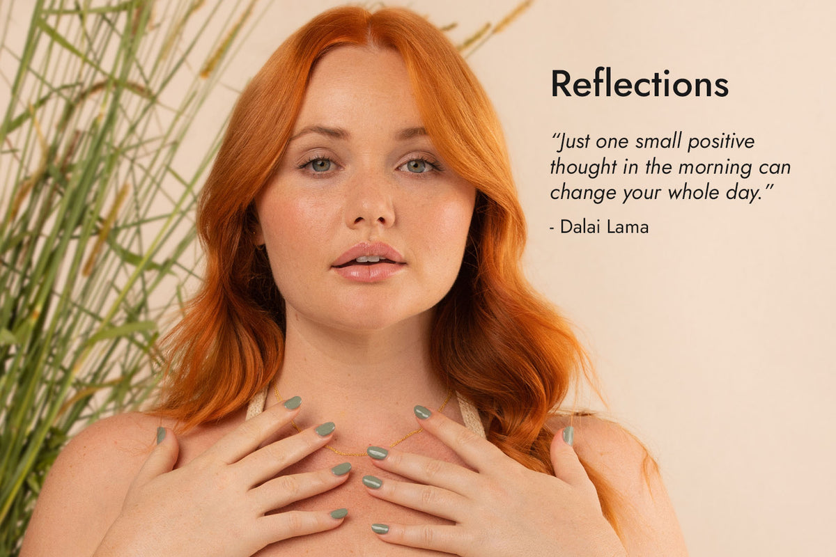 Fair skin woman with auburn red hair wearing Soundscape sage green nail polish by Sienna Byron Bay