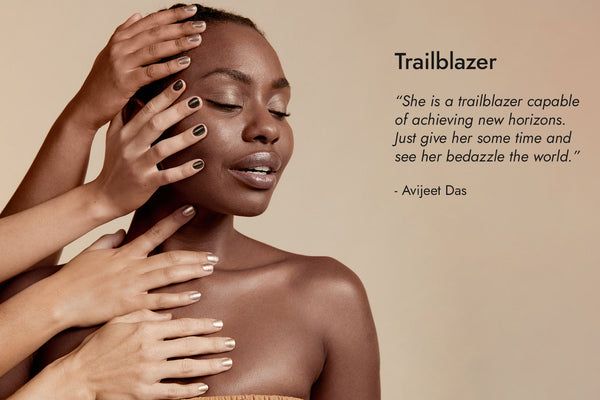 Woman with dark skin tone and hands with different skin tones wearing Sienna nail polish, their hands are on her body, with Trailblazer text and quote.