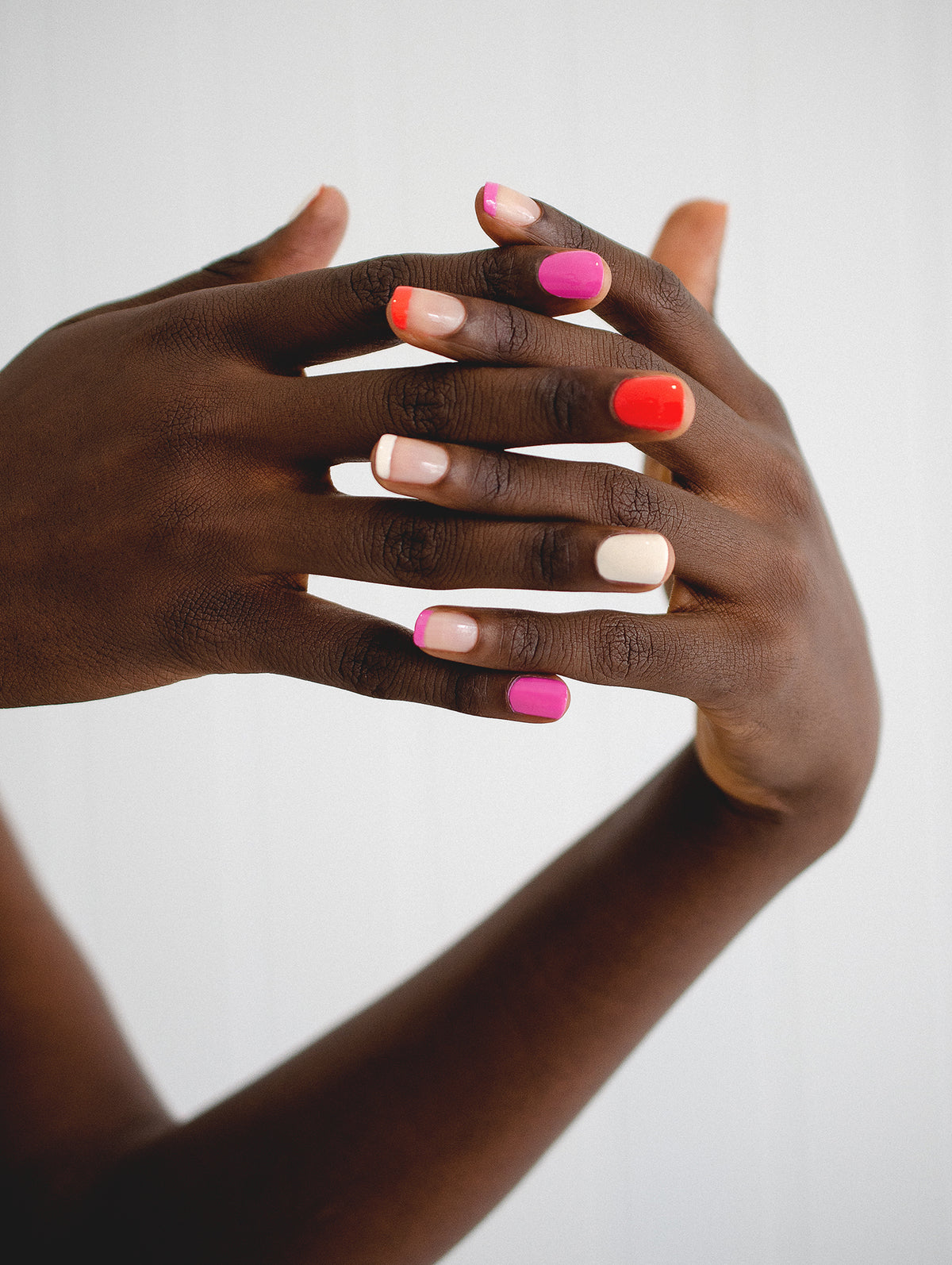 skittle nails with bright colours on dark skin tone by sienna