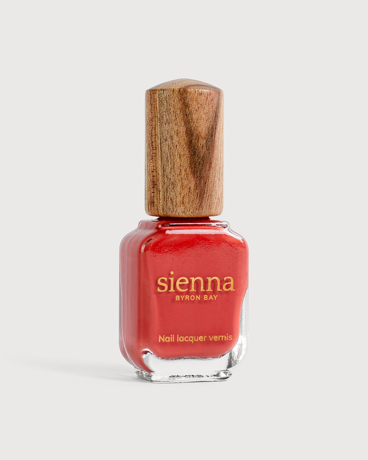 Endearment bottle with timber cap. Endearment natural nail colour is a deep, rich, earthy orange red creme glaze