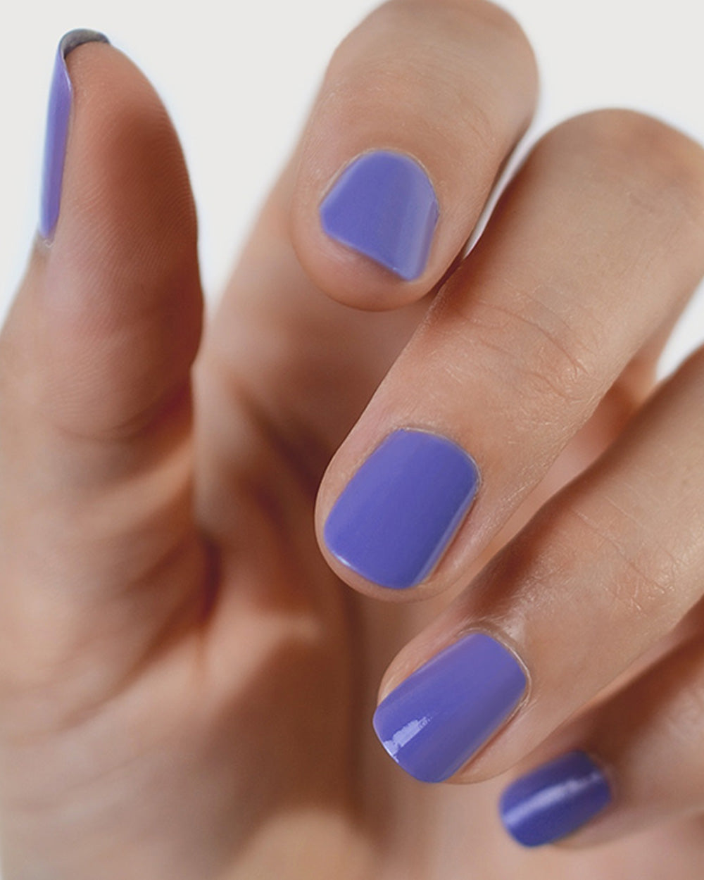 Gentle Blue Lilac Crème nail polish by Sienna Byron Bay on fair skin tone hand.
