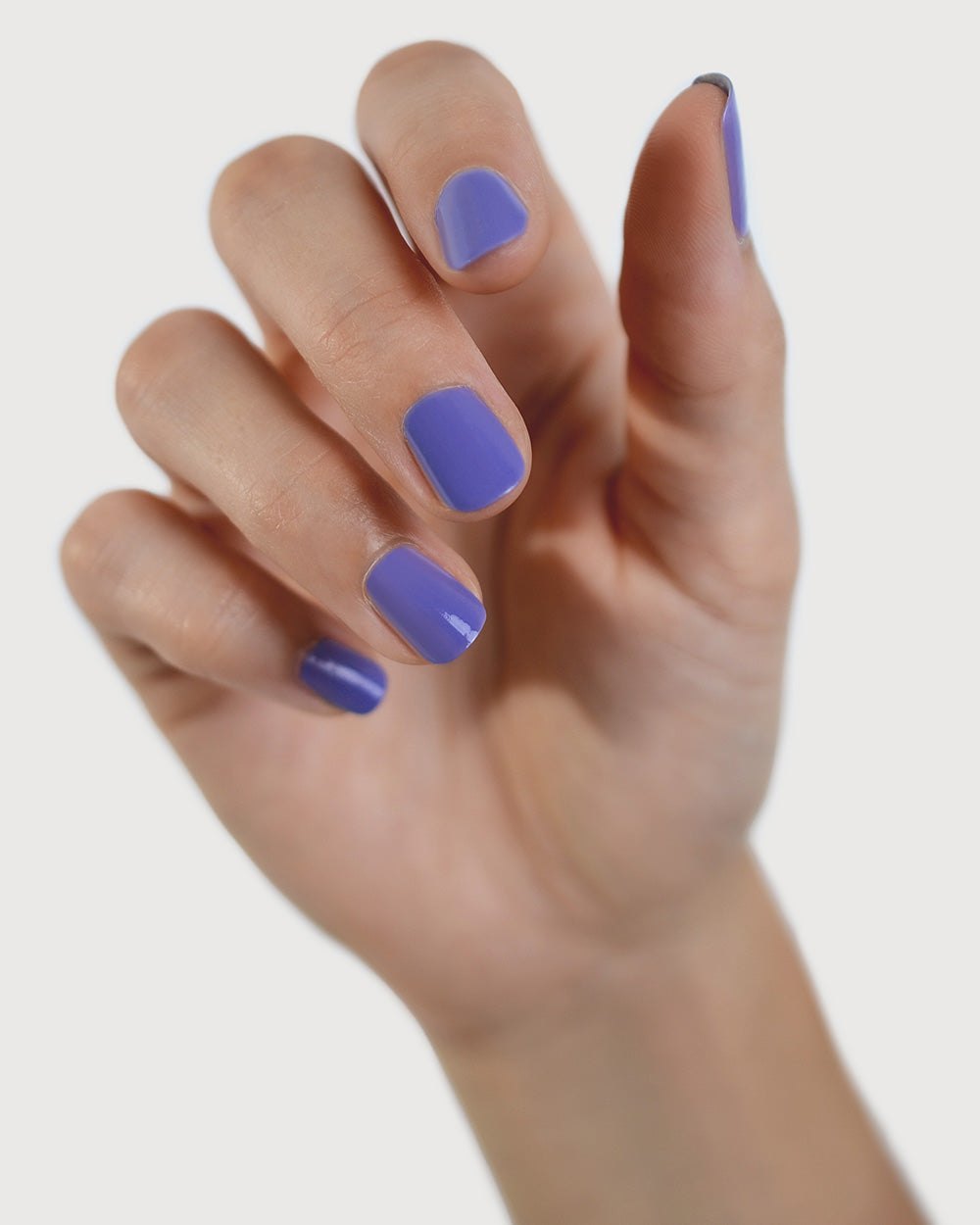 Gentle Midtone Blue Lilac Crème nail polish by Sienna Byron Bay on fair skin tone hand.
