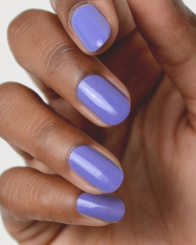 Gentle Blue Lilac Crème nail polish by Sienna Byron Bay on medium skin tone hand.