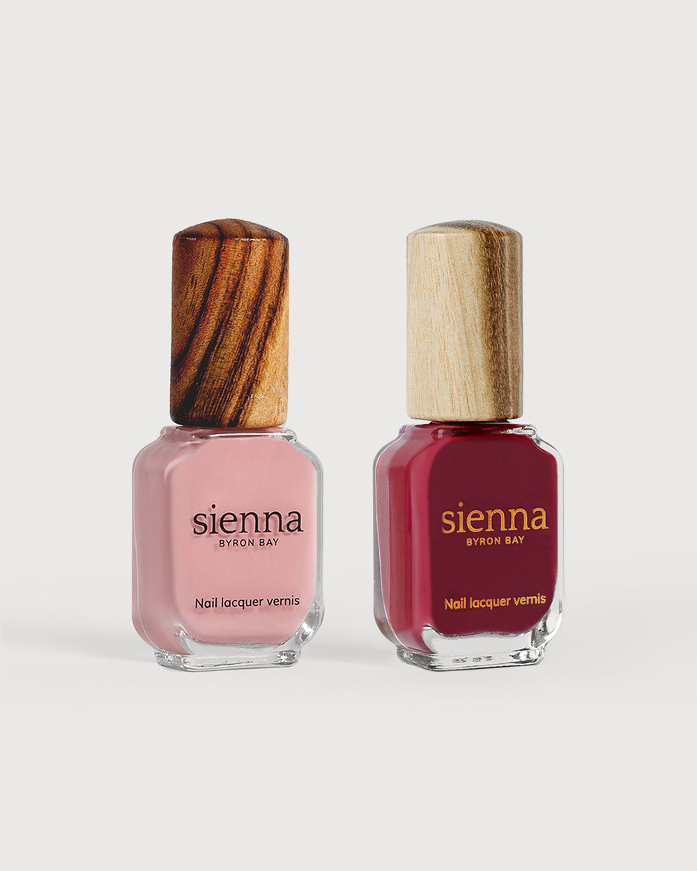 Cherry Blossom Crème and Plum red nail polish glass bottles with timber caps