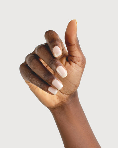 Milky Sheer White nail polish on dark skin tone 