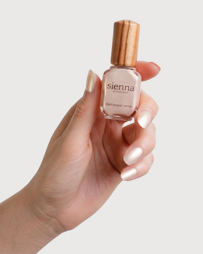 Warm Ivory Pearl Nail Polish Painted on Fair Skin Tone