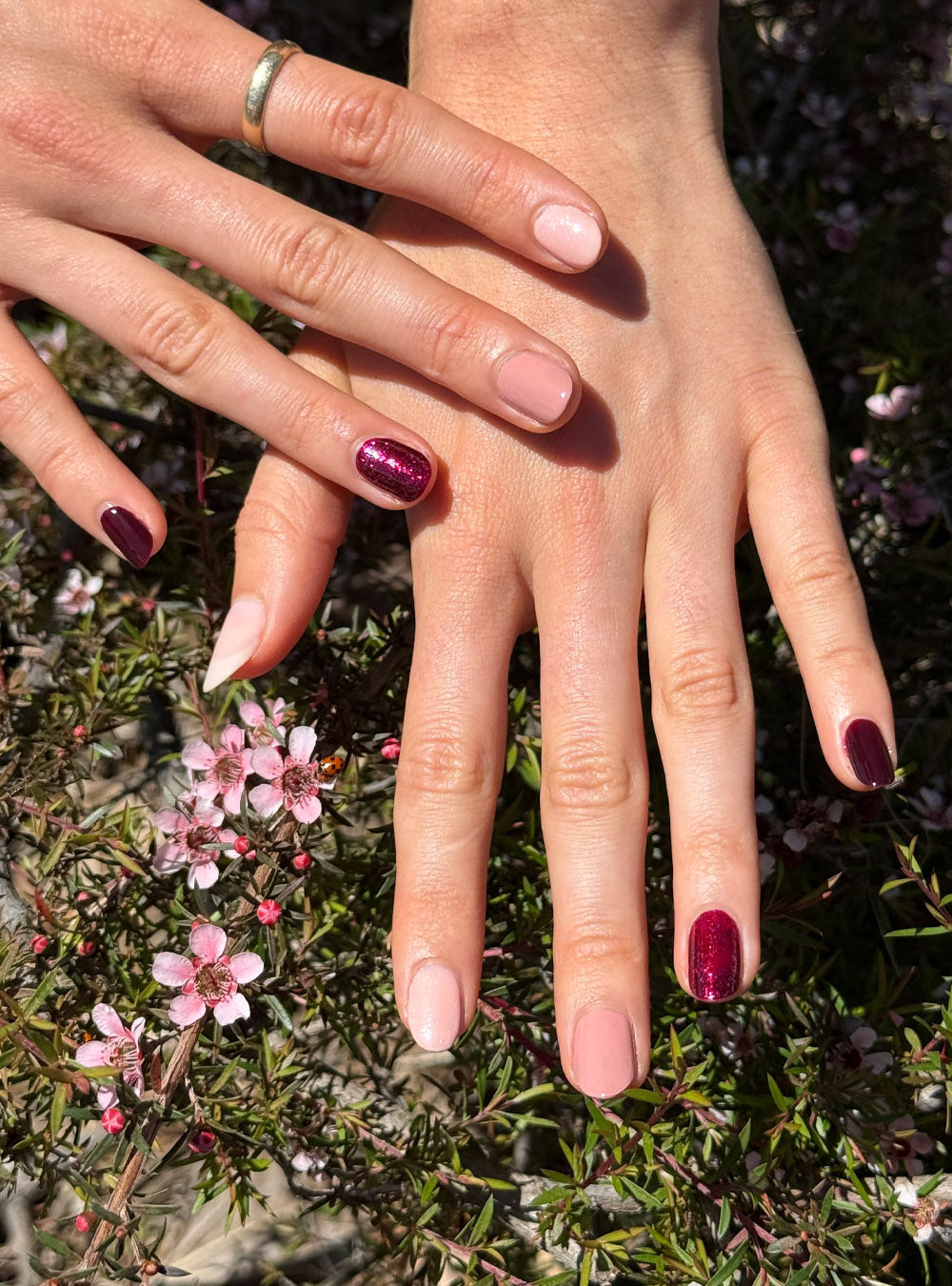 Fair skin hands with natural nails painted with the Midsummer collection colours - Peace, Magic, Rosie, Starlit Rose and Florence.