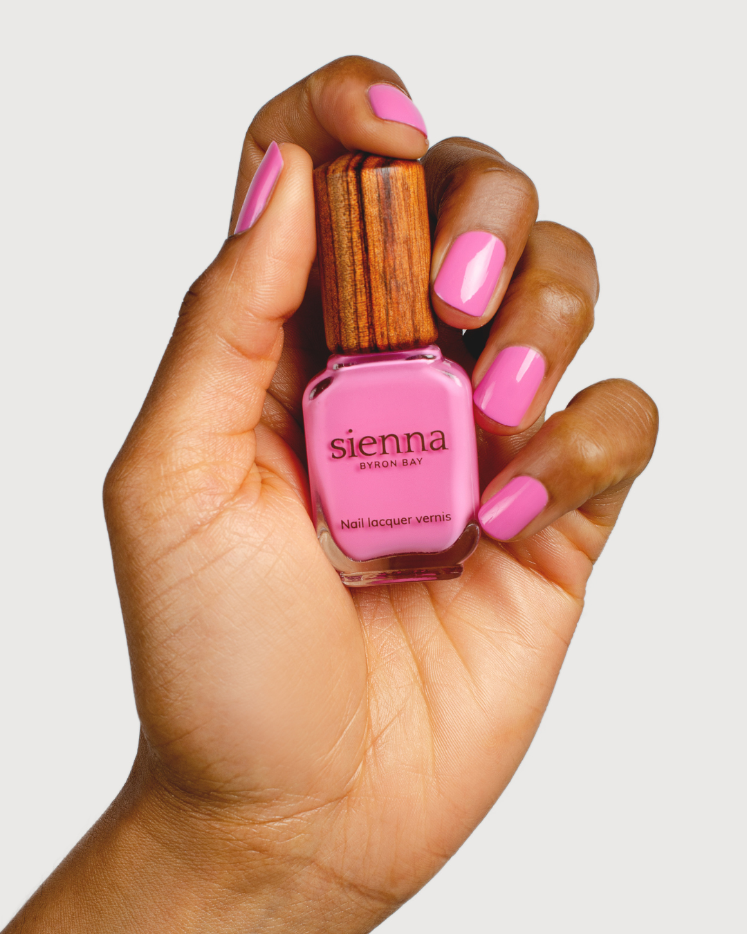 Spell Nail Polish with Bottle on Medium Skin Tone