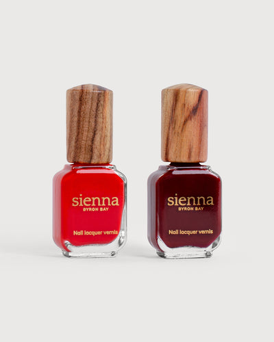 bright red and organic mid-tone red nail polish glass bottles with timber caps