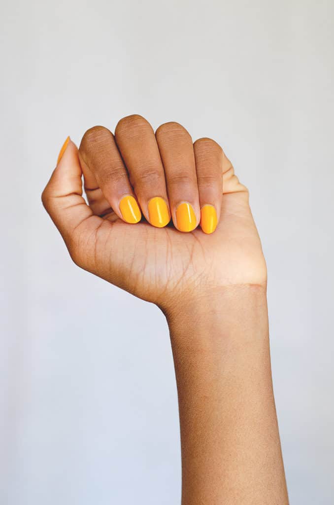 Sunflower Yellow Nail polish hand swatch on medium skin tone by Sienna