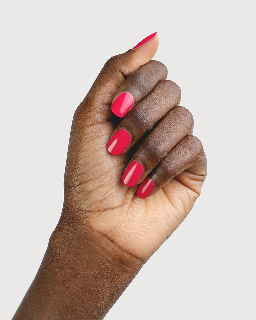 Blooming Fuchsia Petal Pink Nail Polish on Dark Skin Tone with Bottle