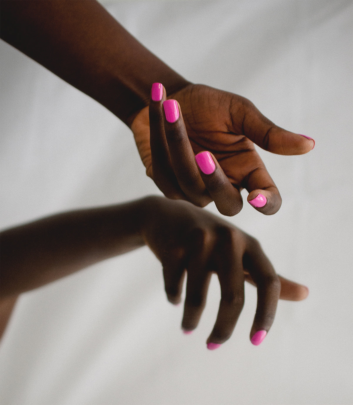 fuschia nail polish on dark skin tone by sienna