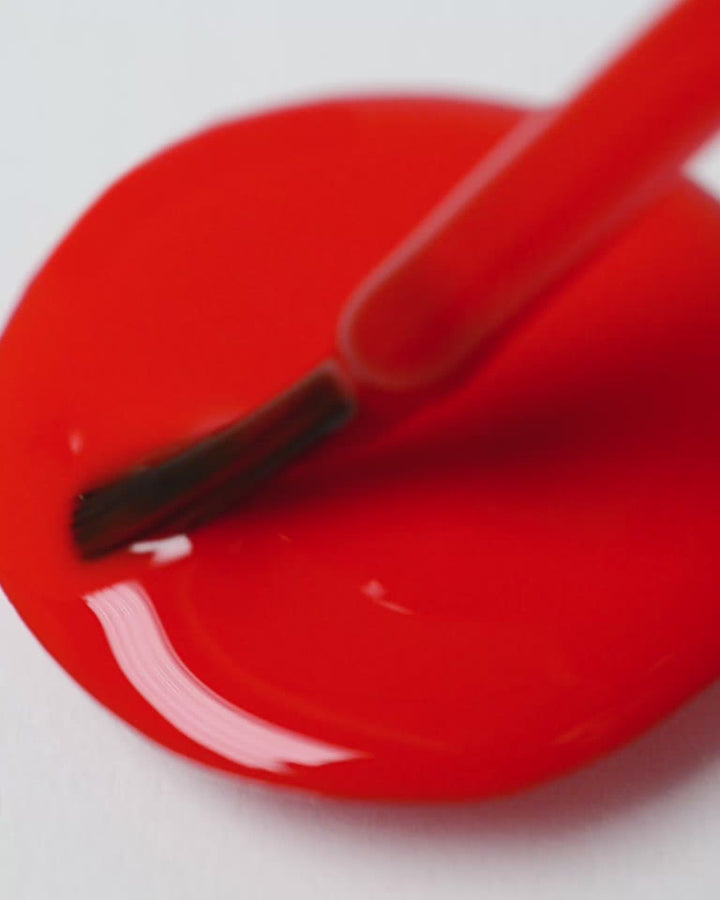 bright red nail polish drop by sienna