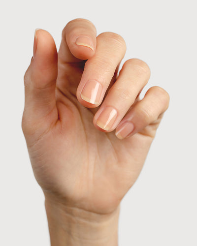 nude sheer nail polish hand swatch on fair skin tone