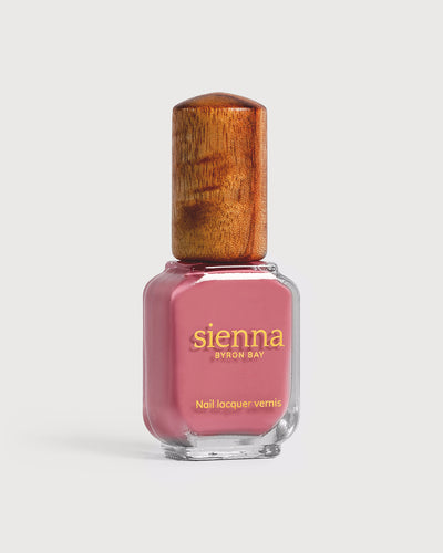 midtone pink nail polish glass bottle with timber cap