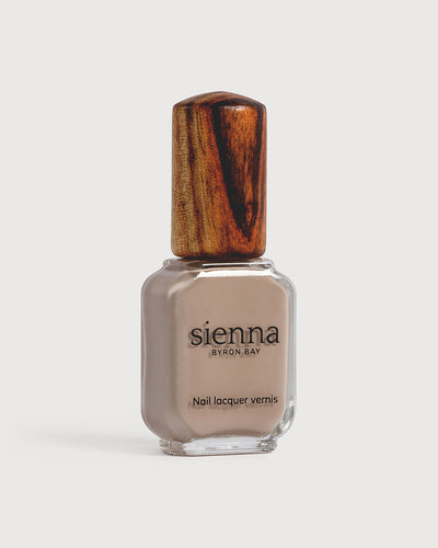 beige nail polish bottle with timber cap by sienna