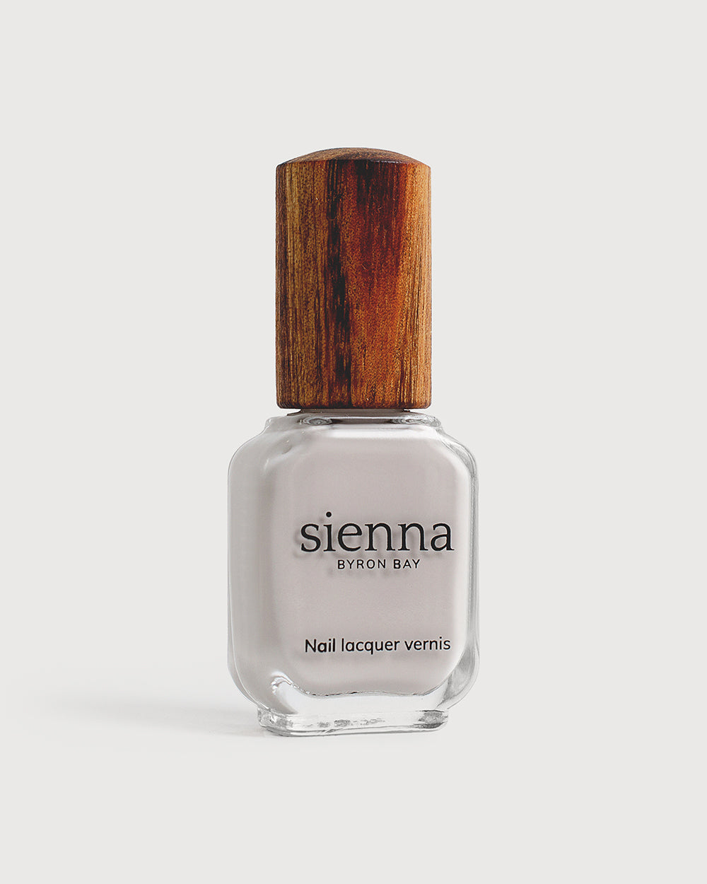 cool grey nail polish in a glass bottle with a timber cap