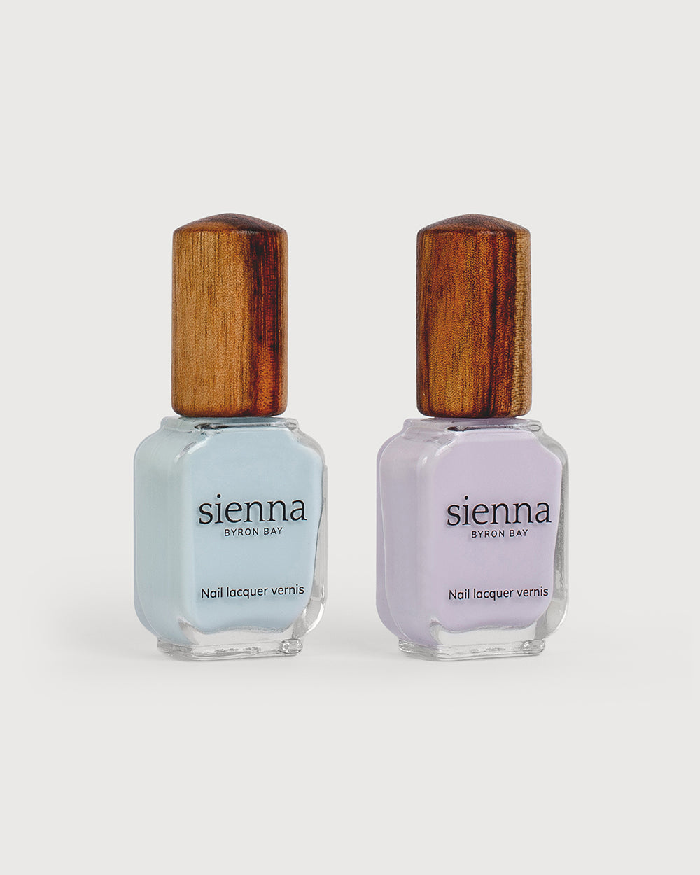 pastel blue and light lilac pastel nail polish bottles with timber cap