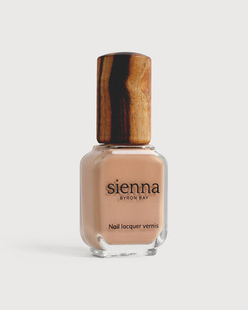 Nude beige nail polish glass bottle with timber cap