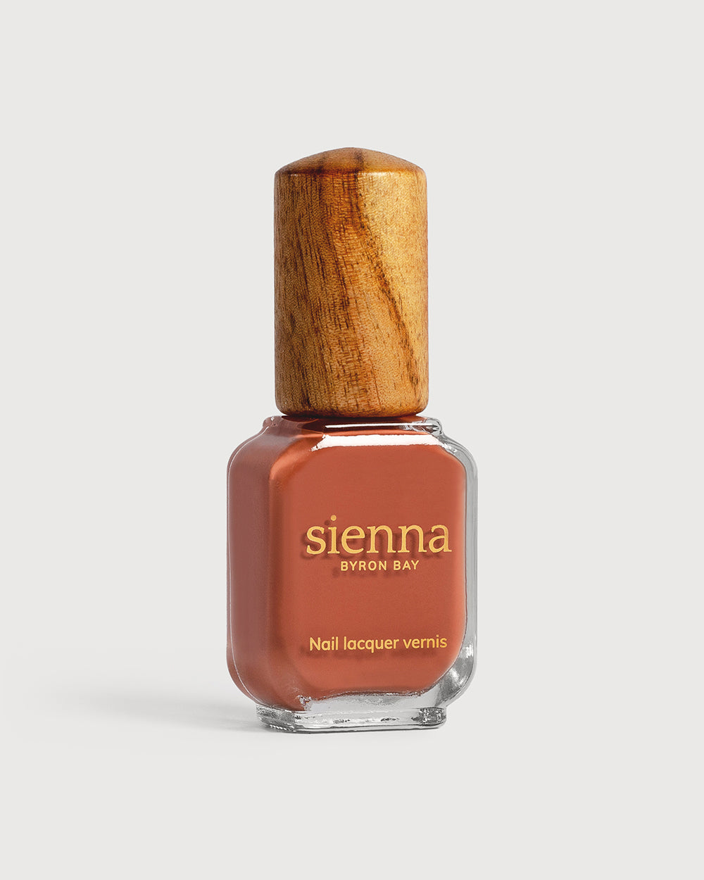 terracotta nail polish bottle with timber cap