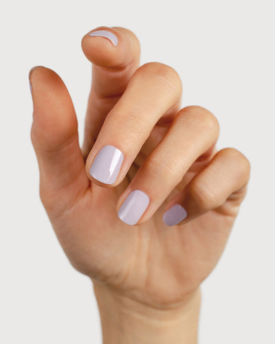 Thistle purple-grey nail polish hand swatch on fair skin tone