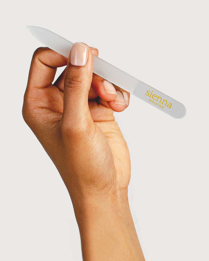 hand holding glass nail file