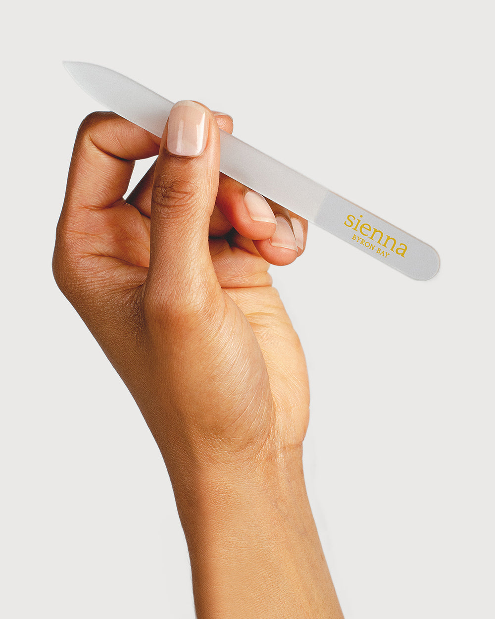 hand holding glass nail file