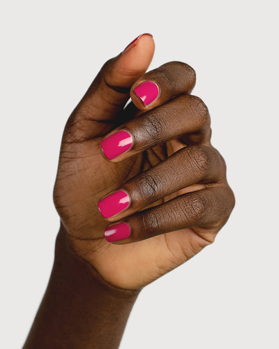 fuschia pink nail polish hand swatch on dark skin tone 