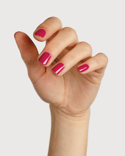 fuschia pink nail polish hand swatch on fair skin tone
