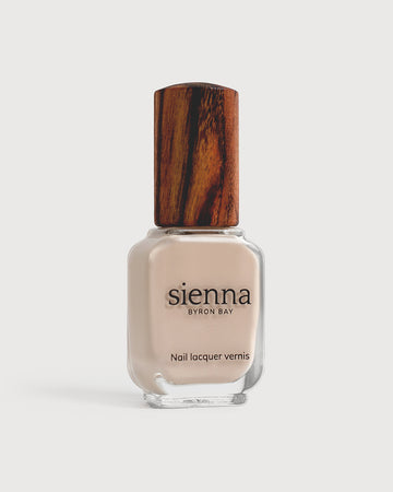 classic beige nail polish glass bottle with timber cap