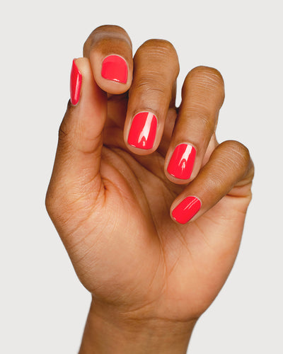 barbie pink nail polish hand swatch on medium skin tone