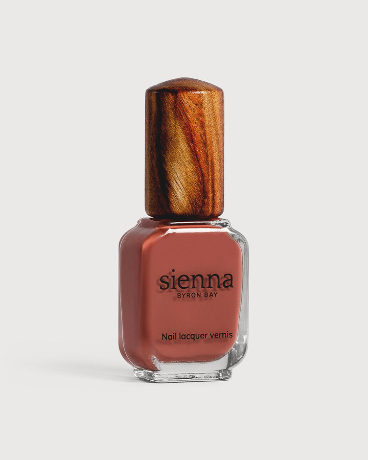 brick red nail polish glass bottle with timber cap