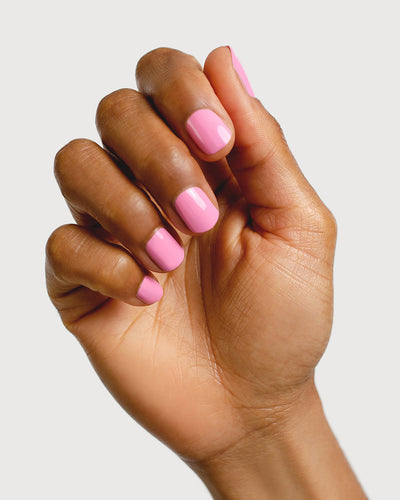 classic lolly pink nail polish hand swatch on medium skin tone