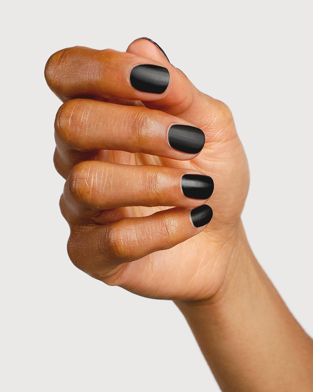 clear matte top coat nail polish hand swatch on medium skin tone