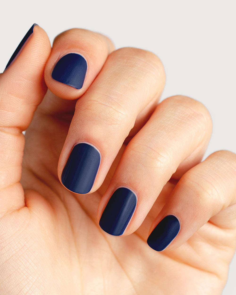 clear matte top coat nail polish hand swatch on fair skin tone