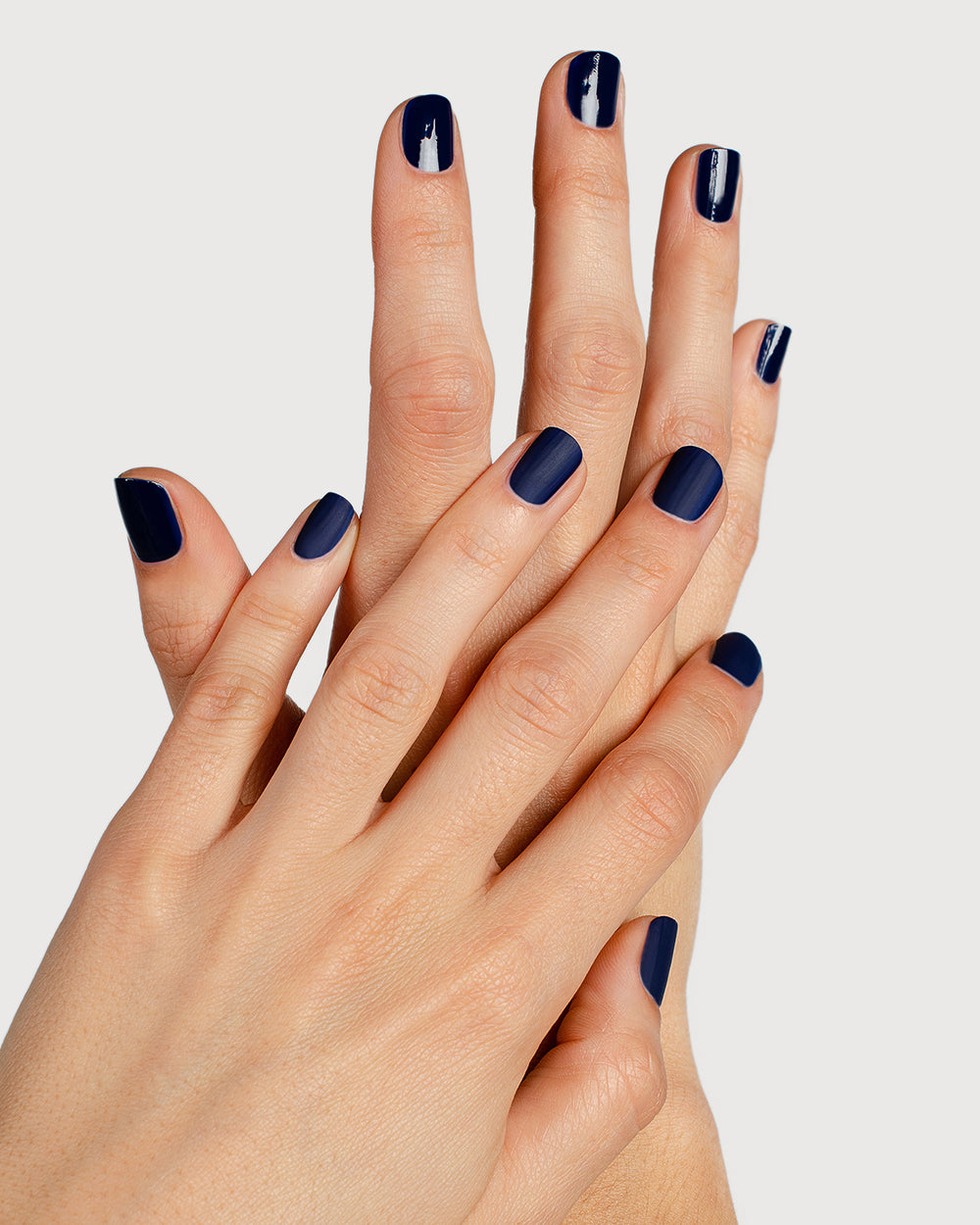 clear matte top coat nail polish hand swatch on fair skin tone two hands together