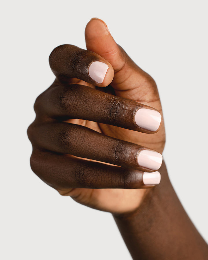 rosewater pink nail polish hand swatch on dark skin tone