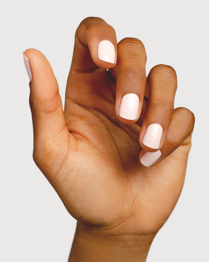 rosewater pink nail polish hand swatch on medium skin tone