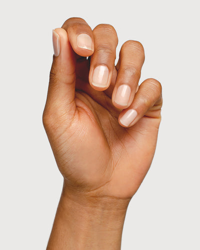 nail strengthener hand swatch on medium skin tone