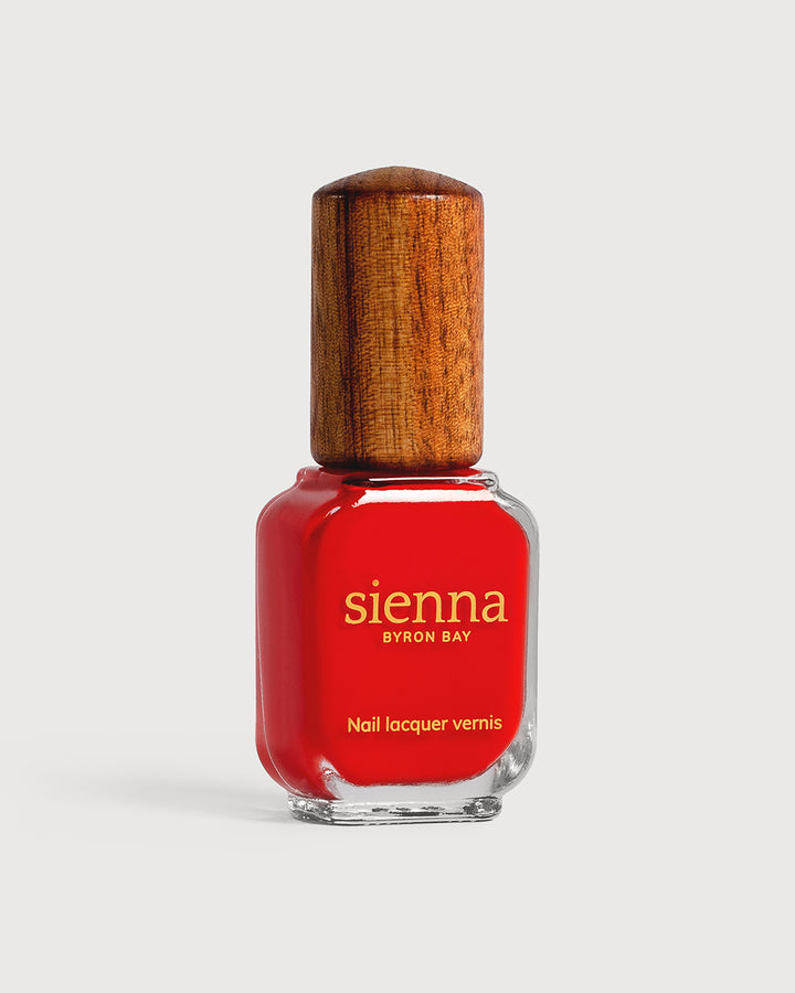 bright red nail polish glass bottle with timber cap